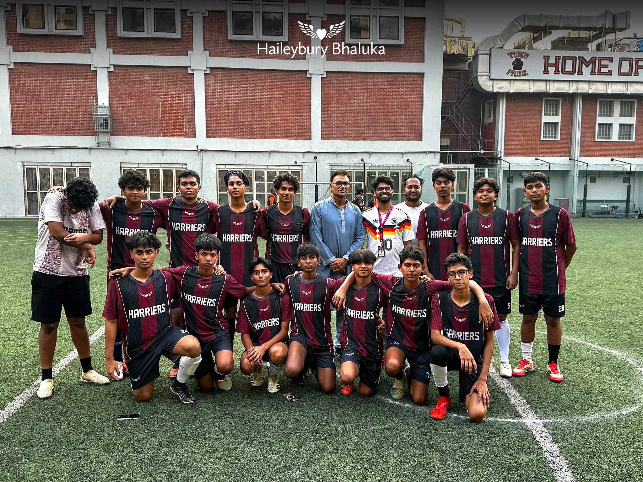 Haileybury Bhaluka and AISD students playing a friendly football match on campus