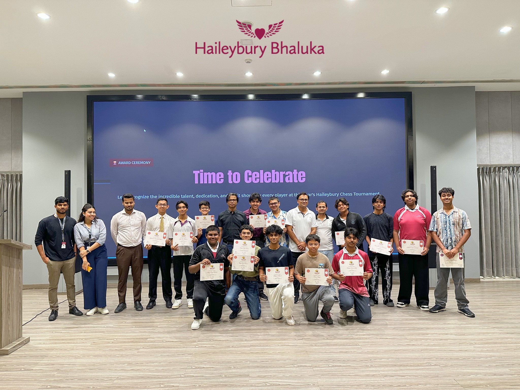 Students on stage at Haileybury Bhaluka Busy Bee Spell 2026 competition