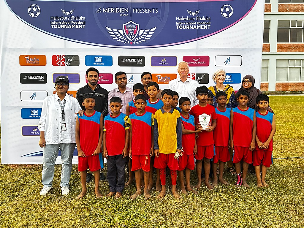 Shishu Polli Plus children and Haileybury Bhaluka students playing football together at HBIFT 2025